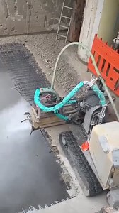 This video shows an operator performing hydrodemolition, a high-precision concrete removal method that uses ultra-high-pressure water jets—up to 3000 bar (43,500 PSI). Hydrodemolition selectively removes damaged or deteriorated concrete while keeping sound concrete and embedded rebar fully intact, making it ideal for structural repairs. The operator is equipped with full personal protective equipment (PPE), including a protective suit and helmet, to stay safe from high-pressure water and flying 