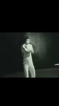 Bruce Lee Playing Ping Pong with Nun chucks