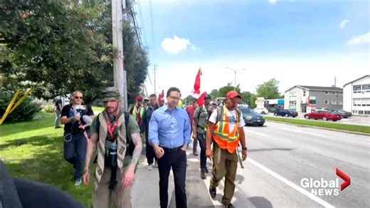 Poilievre marches at head of convoy protesters alongside man who appeared on far-right podcast