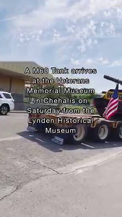 Onlookers watch as a M60 tank arrives at the Veterans Memorial Museum in Chehalis from the Lynden Historical Museum on Saturday, May 20. M60 tanks like this saw limited use during the Vietnam War but played a significant role in the Cold War being one of the most advance heavy tanks used as a deterrent against Russian assaults in NATO countries, according to Museum Director Chip Duncan. | The Chronicle