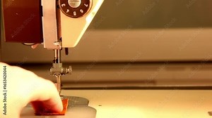 working on clothing make Seamstress thread in the needle of sewing machine, sewing machine and woman hands dressmaking and repair jobs design