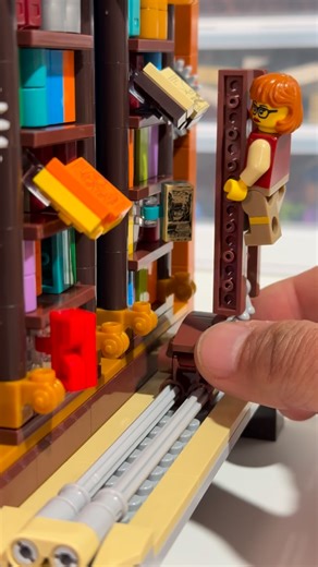 The City of Brickinghamshire | The towering bookshelf in the Lumibricks Time Rift Library is crammed with tiny, colorful book spines and little artifacts, and somehow it... | Instagram