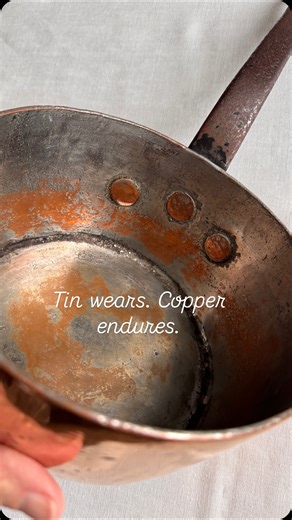 Marjorie Rose, owner A French Antique Affair on Instagram: "Worn tin is normal in antique copper. Over decades of cooking, the tin thins, darkens, and eventually reveals the copper beneath. None of this means damage. It simply means the pot is ready for a fresh tinning and another generation of use. This Gaillard shows classic 19th-century age: softened tin, exposed copper, and the dark ring where old tin has fully broken down. Understanding these signs helps you know when a pot needs retinning 