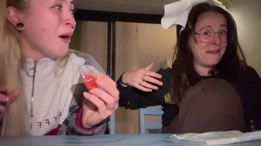 Woman Accidentally Spills Fruit Juice Onto Other Woman's Face While Tasting It