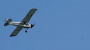 clip-1109497653-small-white-piper-airplane-pulling-banner-via