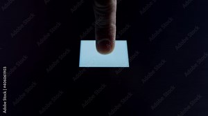 Human finger is pressing a digital button on a glowing touchscreen. Futuristic microprocessor is starting the operation of the computer program. Machine learning and artificial intelligence.