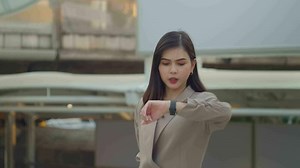 Download A young beautiful businesswoman is  walking in Modern city , city lifestyle concept for free