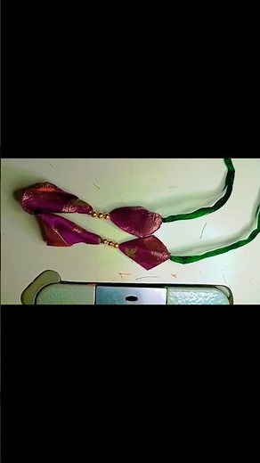 Handmade Silk Fabric Tassel with Golden Beads .