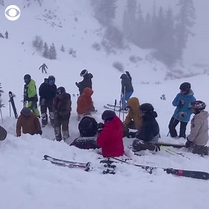 Skiers and emergency workers frantically worked to rescue one victim who became trapped by an avalanche Wednesday at Palisades Tahoe ski resort. Four people were caught in the avalanche, including a man who died and one other person who was injured, officials said. https://cbsn.ws/3SgqYog | CBS Evening News