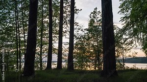 Hyperlapse Sunset Over Forest and Lake: A Mesmerizing Time-Lapse with Camera Motion