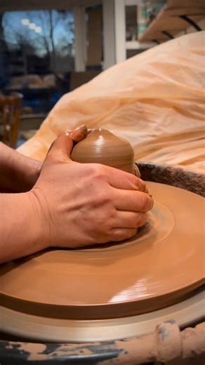 Day one of making a travel mug. After the clay is cut, measured and formed into a ball, it’s time to give the clay a vision of what it will become. Throwing a tall cylinder (I aim for 9”) with soft clay didn’t come easily…I thought throwing with harder clay would solve the issue of not getting enough height but I learned (through trial and error) that a couple simple changes in throwing technique fixed everything…and softer clay has been a dream for my hands and wrists ever since! After the cyli