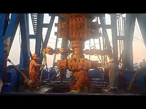 Nipple up BOP stack drilling rig oil industry oilfield well control blowout preventer petroleum