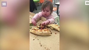 Little Evie proving the age old concept that pizza is life
