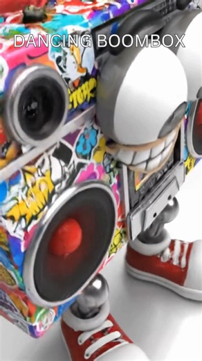 A surreal, toy-like 3D cartoon boombox struts to its own beat 🎶 — bouncing cassette door, waving arms, massive sneakers, and a wide bracketed smile. The camera rotates with every thump, giving a close-up exaggerated view of this vinyl-inspired art toy character. Colorful, glossy, and full of comedy surrealism. Rendered in bold colors with a plastic shine finish. ✨ Perfect mix of toy aesthetic cartoon energy music vibes. #BoomboxDance #CartoonToy #VinylToyArt #ComedySurrealism #BitMelt #DancingB