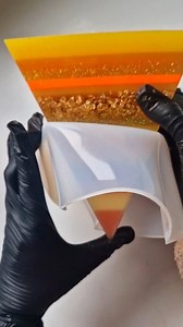 2.4K views · 200 reactions | Once of my proudest custom creations Over two weeks in the making Tip in tact and not a bubble in sight Using the incredible @mouldd_resin epoxy resin as completed in layers This orange yellow and gold pyramid may be the best thing I've ever made as I was honoured to be asked to make them #pyramids #resinpyramid #slowart #layeredart #lilyminilli #demoulding #resinarts #resindesign | Lily Minilli | Facebook