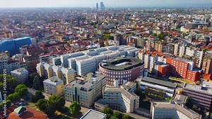 Aerial view of the cityscape and the main buildings of Bocconi University - Building Velodrome. Campus and library. Green lawns and trees. Students. Architecture. Milan Italy Stock Video