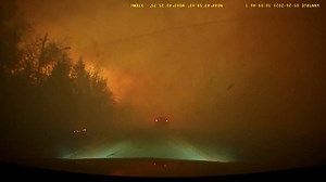 Dashcam footage shows car driving straight through Canadian wildfire