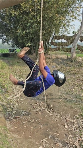 The rope is hung around the neck.