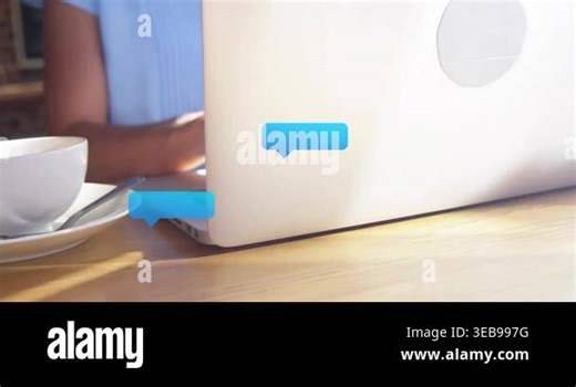 Woman typing on laptop, initiating animated chat bubbles multiplying across table for messaging. Female, cafe, coffee, cup, glasses, smartphone, warmth Stock Video Footage - Alamy