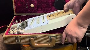 The James Bond of travel guitars: meet the briefcase guitar – an all-in-one amp and foldable Strat that packs into a tweed carry case