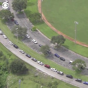 Florida reported a record 21,683 new COVID cases and more than 10,200 hospitalizations over the weekend, which prompted an increased demand for testing. Long lines for COVID tests formed at a Fort Lauderdale park on Monday as infections continue to spread. | CBS Evening News