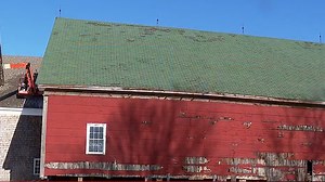 Historic Shaker barn lowered back into place in New Gloucester