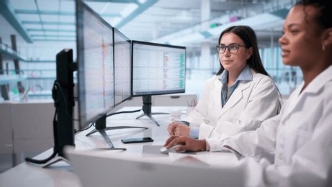 clip-4008180649-doctors-coding-medical-bills-on-hospital-computer