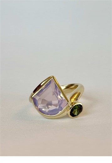 A really special custom for J. 14k yellow gold cast from hand carved wax, featuring her lilac quartz and tourmaline representing people she loves. I love rings like this, an ode to her own resilience that inspired a really adventurous and fun design. Such a pleasure to make! If you want a piece of jewelry to tell your own story, get in touch! #jotd #customjewelry