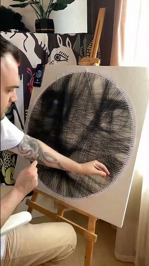 Artist spins a feline string art project instead of drawing a simple portrait