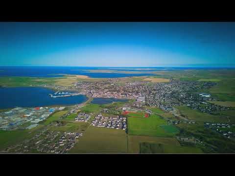 Arial footage of Kirkwall and surrounding farmland, Orkney Islands, UK
