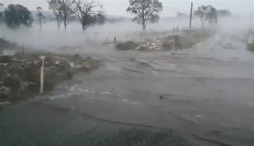 Its the fire ravaged area of Tenterfield receiving some much needed rain now, as a heavy thunderstorm brings flash flooding and hail to the area. This video was taken around Mount MacKenzie . Not for media use or article embedding. | Northern NSW Severe Weather