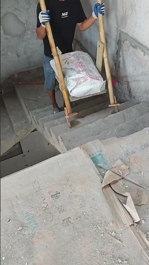 A clever farmer has crafted a foot-operated tool for carrying goods upstairs