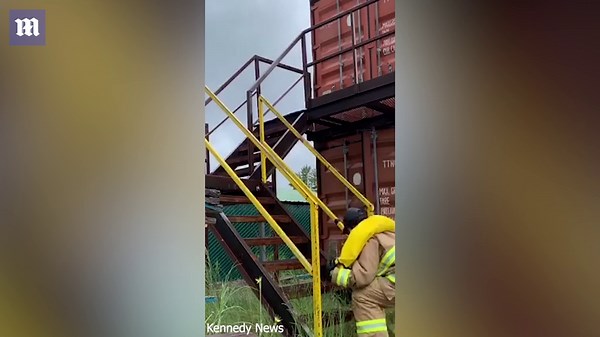 American female firefighter flaunts strength with hardcore workout