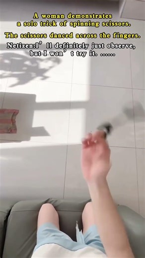 A woman demonstrates a solo trick of spinning scissors.