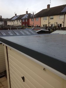 A small garage fibreglass flat roof with new timbers throughout, complete with soffits and guttering | Merlin Fibreglass Flat Roofing