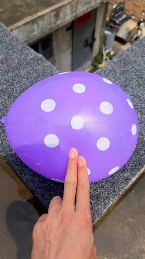 Experiment: Will a water balloon explode if it rolls down a tall building? 💥🎈 #balloon
