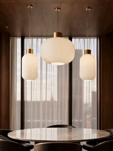 Modern dining space inspiration ✨ A dining room shaped by simplicity and intention. Smooth surfaces, muted tones, and warm lighting work together to create an atmosphere that feels calm yet refined. The glass lighting becomes the quiet focal point, adding softness and rhythm to the space while maintaining a modern, balanced, and inviting look #ModernDining #DiningRoomInspo #InteriorInspiration #ModernInteriors #ContemporaryHome