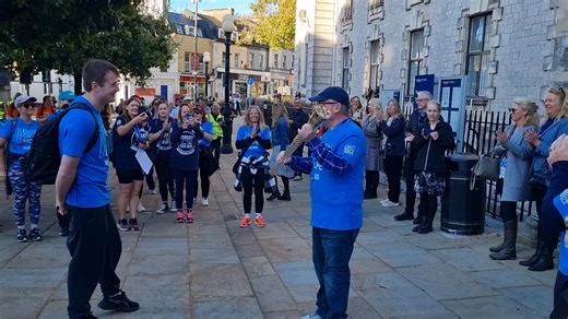 Cllr Nick Bye showing the Baton of Hope to the crowd outside Torquay Town Hall. | Cllr Hazel Foster For Wellswood