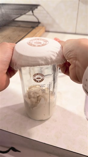 Joylinn on Instagram: "Let’s feed mother Judy and put her in our new jar from @cozy__bread I love that it has the strap with the time and days! Haven’t seen Pamela in a while? I think it might be time to get her out of timeout 😂 #microbakery #breadgram #sourdough #lancasterpa #baking"