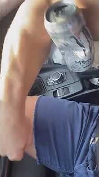 Massive muscle man crushing cans with his bicep