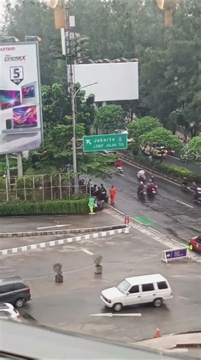 Jakarta Street Scene Rainy Day - High Traffic Road Signage Free Copyright Stock Footage