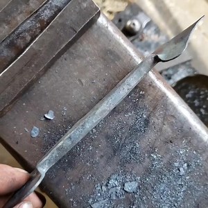 Showing the bottom swedge I use for giving my cabinet/drawer pulls a nice rounded face. I pre-shape the piece to fit in the swedge, then get it good and hot and carefully forge it in, allowing it to stretch lengthwise. Looks easy, but there's actually a lot of details that go into getting good results. After this step, I allow the piece to cool, and then round over the back corners with a file. I need to make some bigger versions of this swedge soon to make latch handles and other larger pulls. 