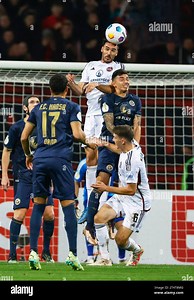 Nuremberg, Germany. 01st Nov, 2023. Soccer: DFB Cup, 1. FC Nürnberg - Hansa Rostock, 2nd round, at Max Morlock Stadium. Nuremberg's Ivan Marquez (center) wins the header duel against Rostock's John-Patrick Strauß (2nd from right). Credit: Daniel Löb/dpa - IMPORTANT NOTE: In accordance with the requirements of the DFL Deutsche Fußball Liga and the DFB Deutscher Fußball-Bund, it is prohibited to use or have used photographs taken in the stadium and/or of the match in the form of sequence pictures 
