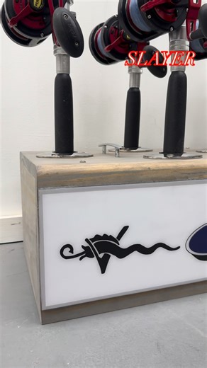 Slayer Racks LLC on Instagram: "Perfect example of a custom resin name mounted on a standard rack of 10 making this rack truly unique to the client. We used his custom art work and added the @vikingyachtcompany crest to give it an even more unique finish. This unit came out beautiful and I can’t wait to see it put to use. #SlayerRacksLLC #SlayerProducts #slayer #Viking #offshorefishing #inshorefishing #fishing #rodrack #rodstorage #onlyrackyourwifewillletinthehouse #wahoo #tuna #mahi #marlin #oc