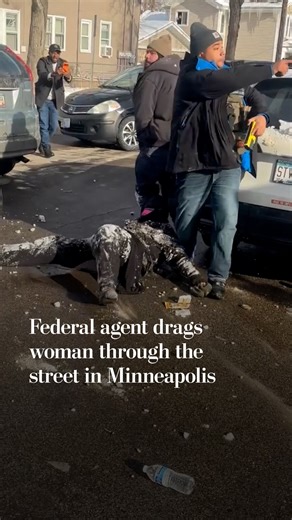 Federal agent drags woman through the street in Minneapolis