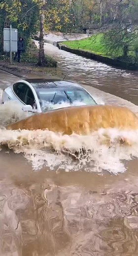 Car Crossing Deep Waters - Tesla Electric Car Adventure