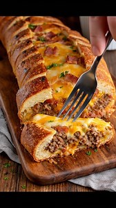 This Garbage Bread is a fun twist on a family favorite that always brings everyone around the table, and trust me, it's hard to stop at just one slice! It’s the ultimate cozy comfort food, so grab that recipe in the comments below! 👇 | Recipes & Cooking Guide