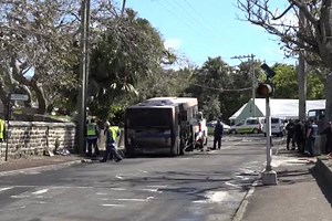 TRANSPORT officials tonight launching a FULL investigation into how this bus, carrying a dozen kids, exploded into flames. Explosions can be seen on the video. Tari Trott reports. | Bermuda Broadcasting Company