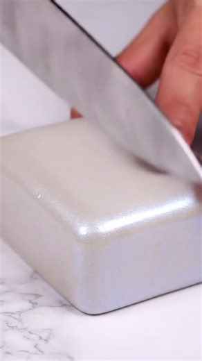 A Calm, Sensory Macro Experience ✨ Watch the moment the knife meets the waxy surface of the “slime brick” — how it compresses first, then slowly separates to reveal the folded layers inside. Every precise movement, every gentle press, and every soft ripple at the moment of separation unveils hidden material details, adding a visually and sonically satisfying dimension. The delicate sounds of rubbing and tiny pops beneath the hands make the experience meditative and soothing, while the camera foc