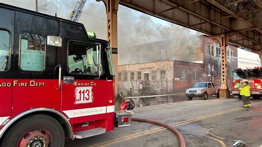 Large fire burns at commercial building near CTA tracks; some train service suspended